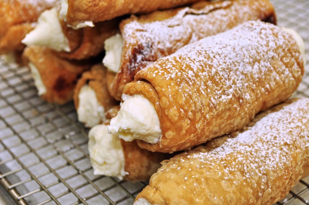 Cannoli filled with ricotta, representing 2020 Census geography shells filled with demographic data
